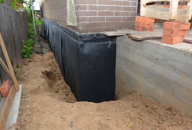 SJ Waterproofing Pros technician performing targeted Wet Basement Repair assessment in Fairless Hills, PA